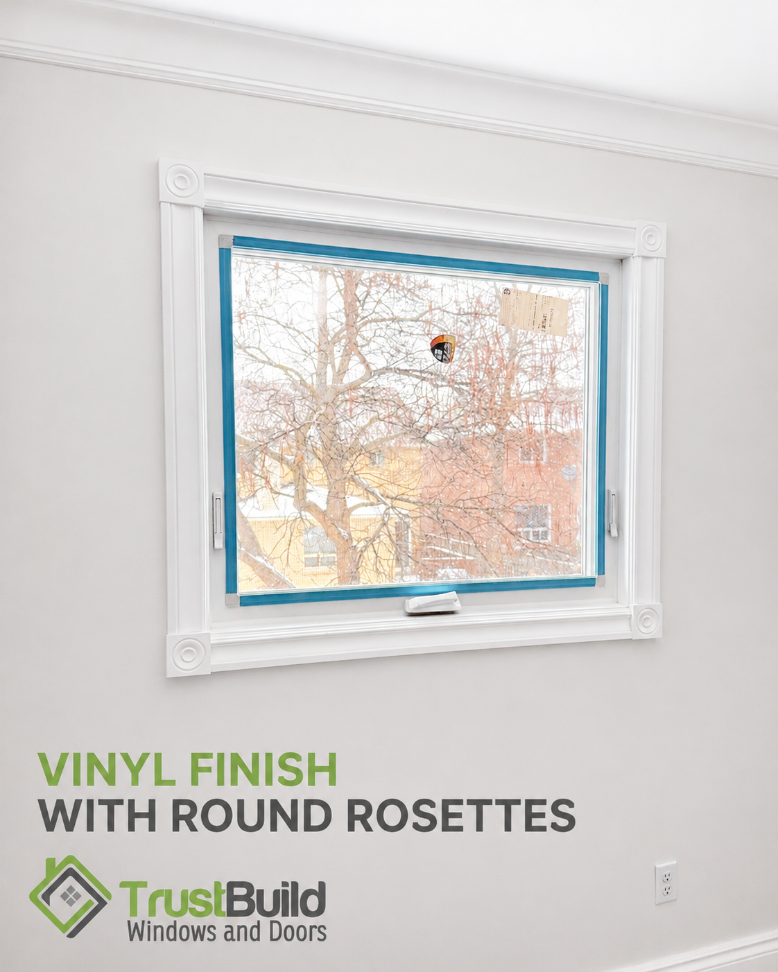 Vinyl casing with round rosettes framing a white awning window on a light-grey wall, Ontario home interior