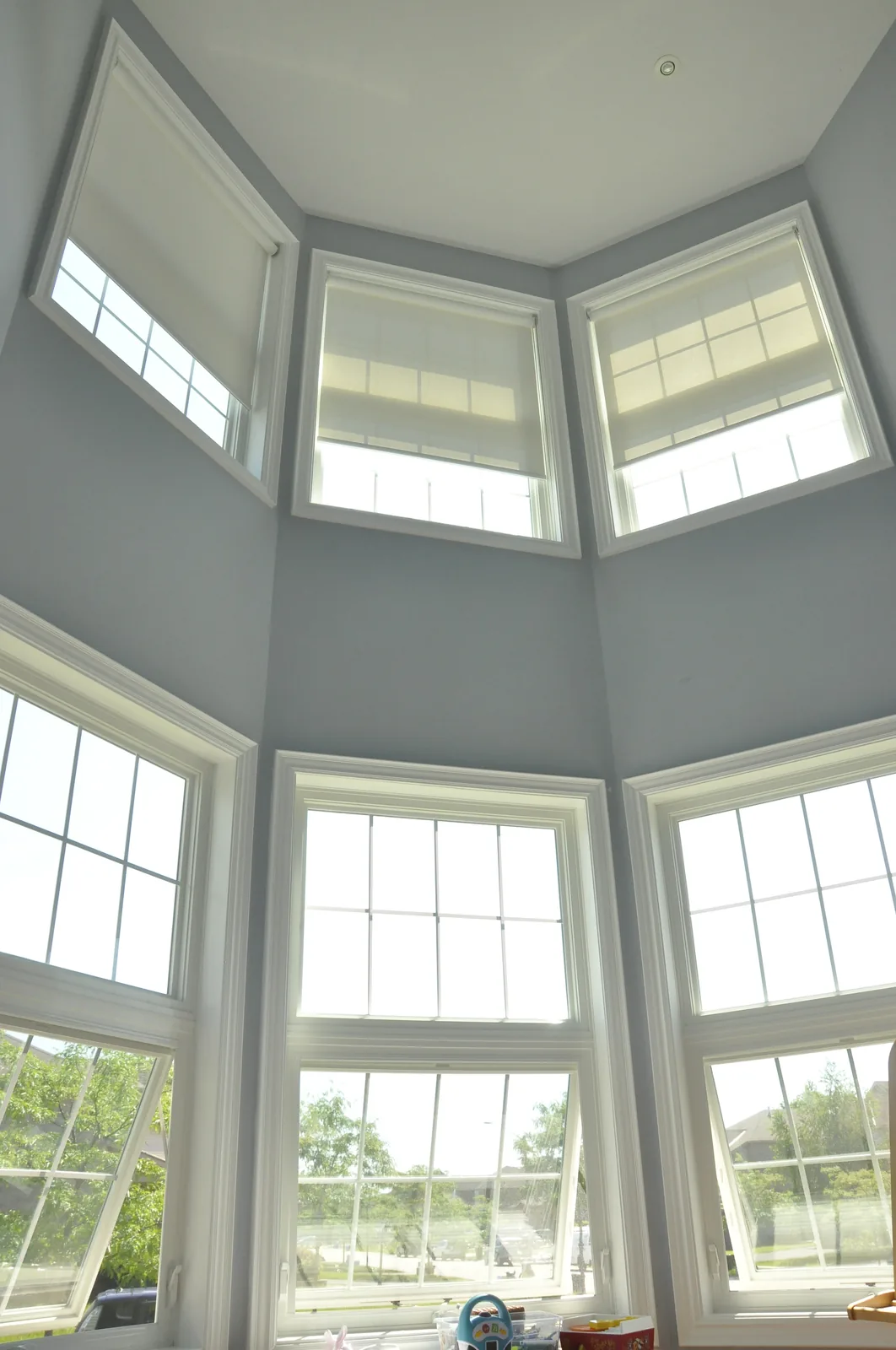 White awning windows in a two-storey great room of a Toronto, Ontario home