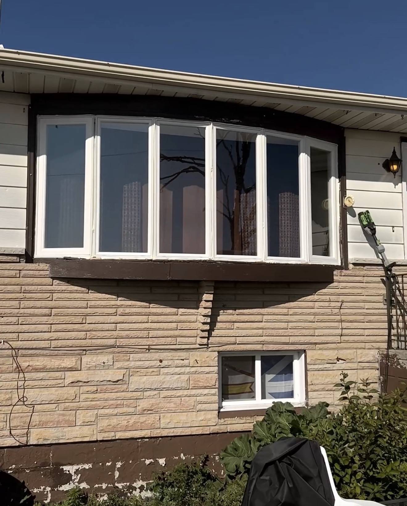 Finished bow window with the two outer casement sections open